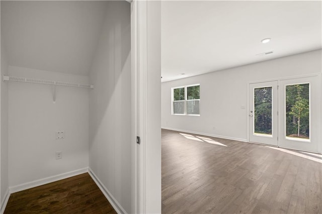 interior space featuring dark wood-type flooring and visible vents