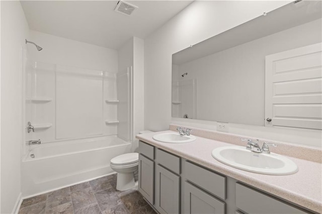 bathroom with shower / bath combination, visible vents, toilet, and a sink