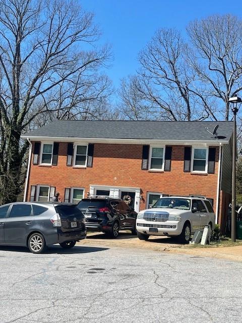 view of front of house with brick siding