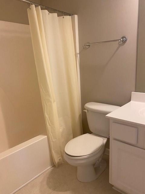 full bath featuring toilet, shower / bath combination with curtain, vanity, and tile patterned floors