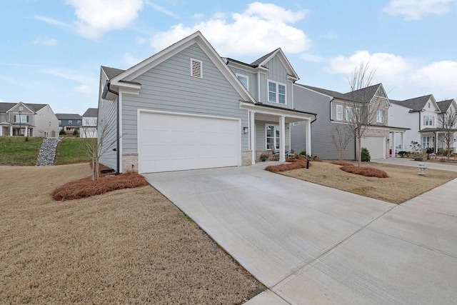 view of front of house featuring a front yard and a garage