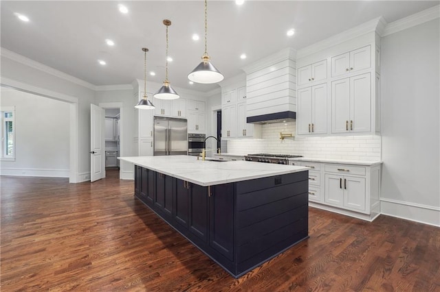 kitchen with appliances with stainless steel finishes, white cabinets, a sink, and ornamental molding