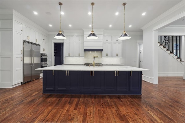 kitchen featuring stainless steel appliances, a spacious island, white cabinetry, ornamental molding, and backsplash