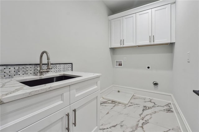 clothes washing area featuring hookup for an electric dryer, a sink, baseboards, marble finish floor, and cabinet space