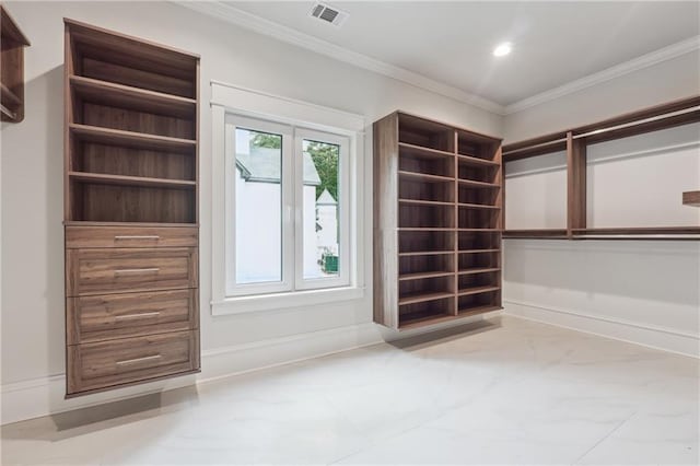 spacious closet with marble finish floor and visible vents