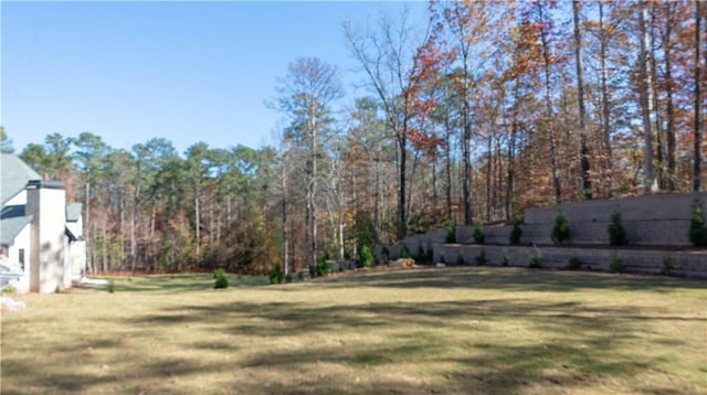 view of yard featuring a view of trees