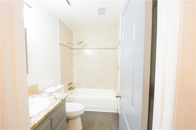 full bathroom featuring vanity, toilet, and tiled shower / bath combo