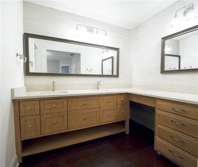 bathroom with vanity and wood-type flooring