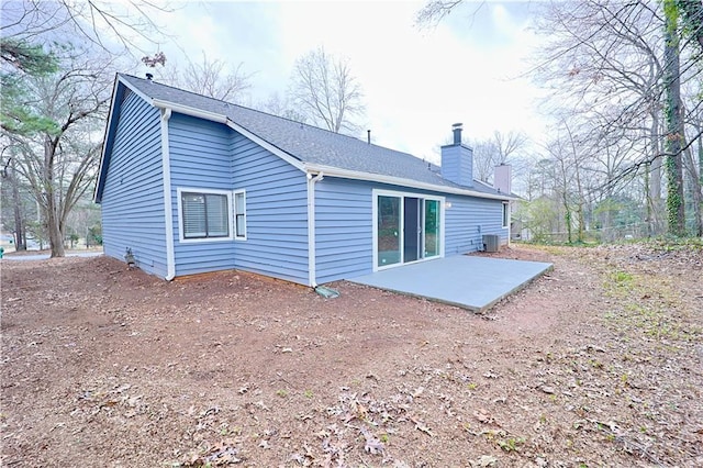 back of property with a patio and central air condition unit