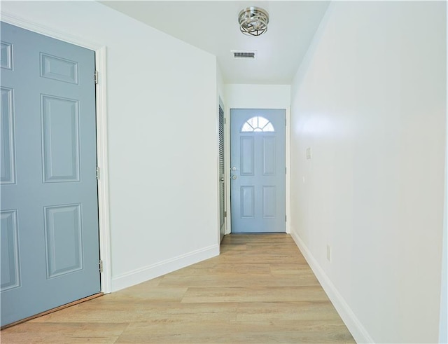 doorway with light wood-type flooring