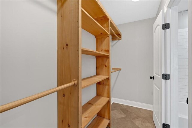 unfurnished room featuring light wood-style flooring, plenty of natural light, visible vents, and baseboards