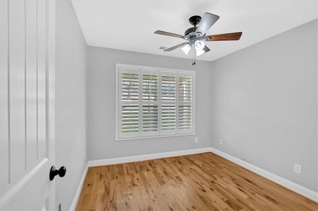 bathroom featuring toilet, bathtub / shower combination, baseboards, and vanity