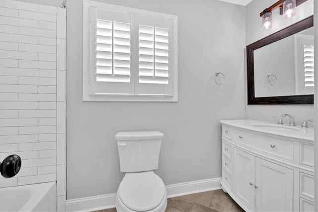 full bathroom featuring  shower combination and baseboards