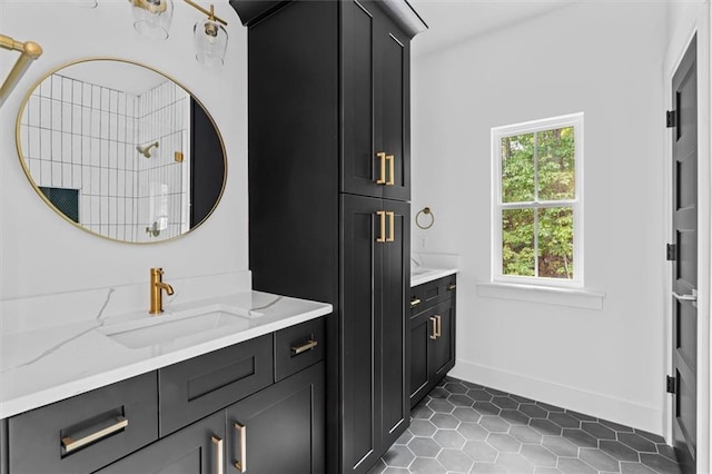 bathroom with vanity, tile patterned floors, and walk in shower