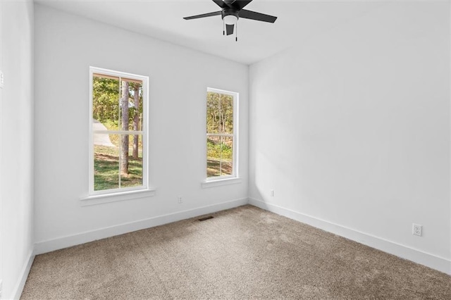 carpeted empty room with ceiling fan