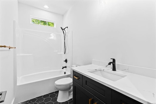 full bathroom featuring toilet, tile patterned flooring, vanity, and tub / shower combination