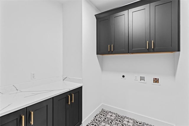 laundry area with hookup for an electric dryer, tile patterned floors, washer hookup, and cabinets