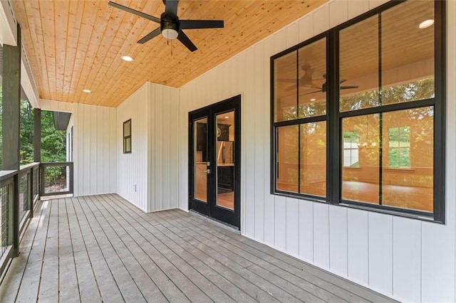 wooden terrace featuring ceiling fan