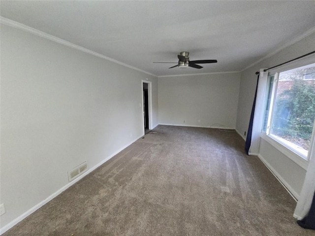 carpeted empty room with ceiling fan and crown molding