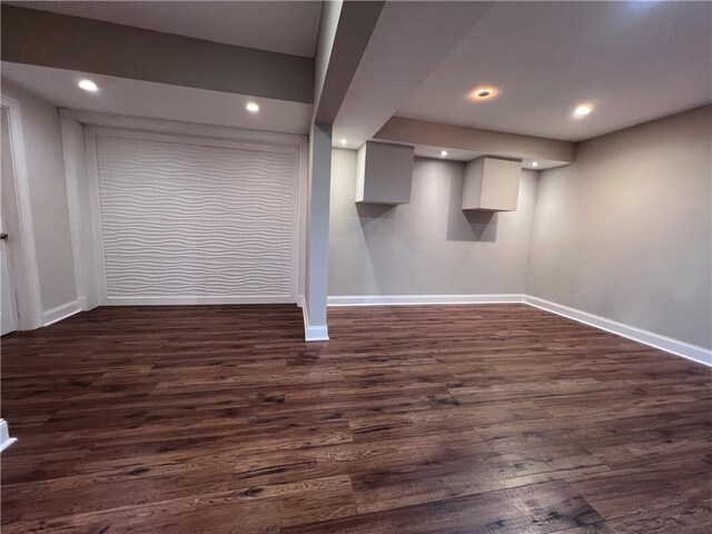 basement featuring dark hardwood / wood-style floors