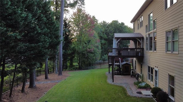 view of yard featuring a deck and a patio area