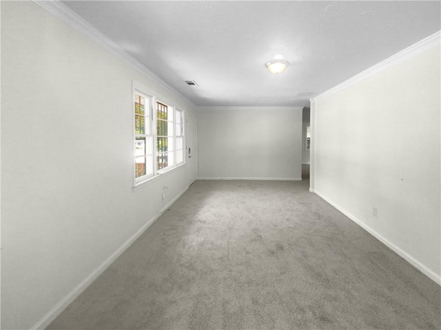 carpeted empty room with crown molding