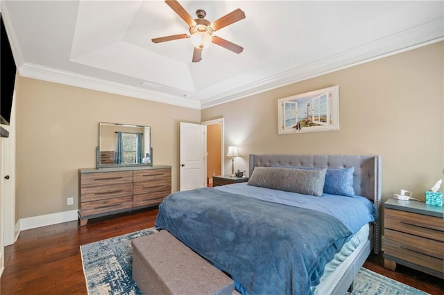 bedroom with dark hardwood / wood-style flooring, ornamental molding, a raised ceiling, and ceiling fan