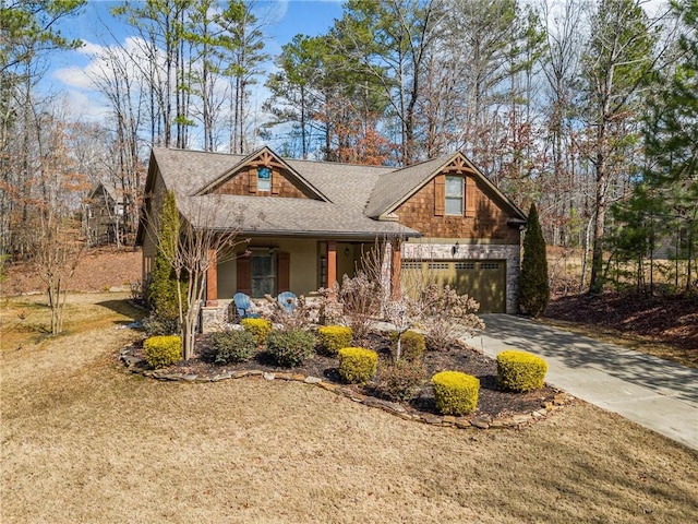 craftsman-style house featuring covered porch and a garage