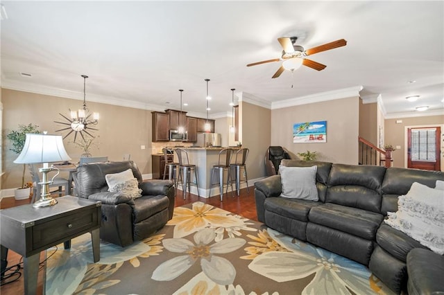 living room featuring ceiling fan with notable chandelier, crown molding, and dark hardwood / wood-style floors