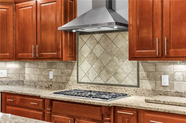 1580 Loving Rd, Morganton, GA 30560 - kitchen with light stone counters, wall chimney exhaust hood, dark brown cabinets, and stainless steel gas stovetop