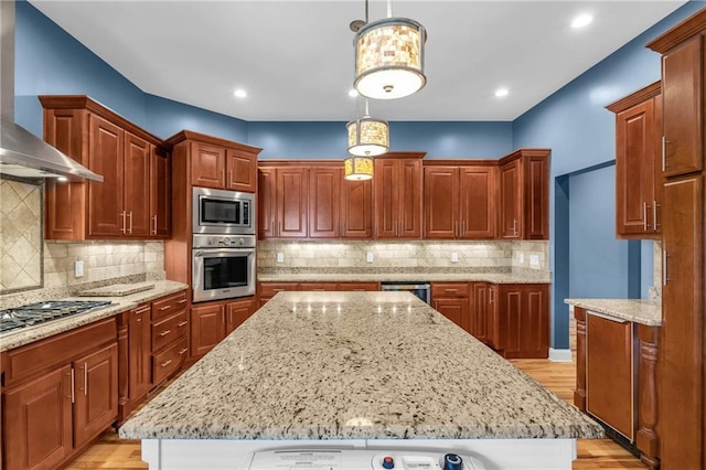 1580 Loving Rd, Morganton, GA 30560 - kitchen featuring wall chimney range hood, appliances with stainless steel finishes, a kitchen island, and light wood-style flooring
