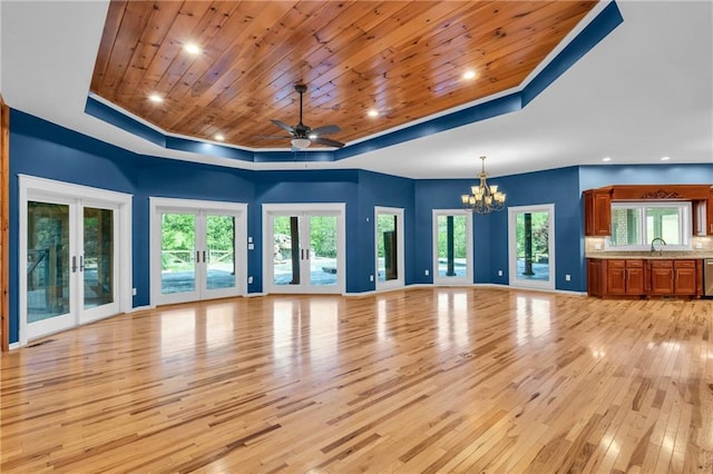 1580 Loving Rd, Morganton, GA 30560 - unfurnished living room with french doors, wooden ceiling, ceiling fan with notable chandelier, light wood finished floors, and a tray ceiling