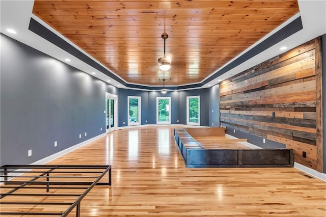 1580 Loving Rd, Morganton, GA 30560 - interior space featuring baseboards, wood walls, a raised ceiling, and wood finished floors