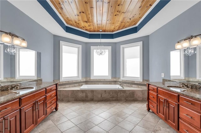 1580 Loving Rd, Morganton, GA 30560 - full bathroom with tile patterned floors, a chandelier, two vanities, and a raised ceiling
