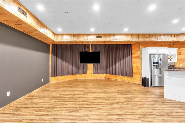 1580 Loving Rd, Morganton, GA 30560 - interior space with visible vents, wood walls, light wood-type flooring, stainless steel fridge with ice dispenser, and recessed lighting