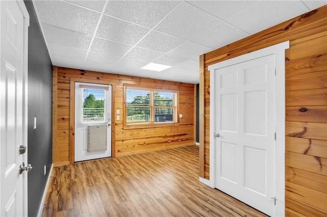 1580 Loving Rd, Morganton, GA 30560 - entrance foyer featuring light wood-style floors, baseboards, a drop ceiling, and wooden walls