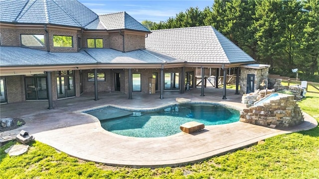 1580 Loving Rd, Morganton, GA 30560 - back of house with brick siding, a patio area, and an outdoor pool