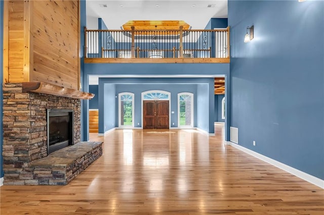 1580 Loving Rd, Morganton, GA 30560 - unfurnished living room featuring baseboards, a high ceiling, and hardwood / wood-style floors