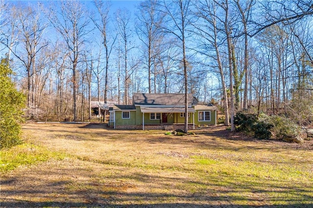 exterior space with a lawn and covered porch