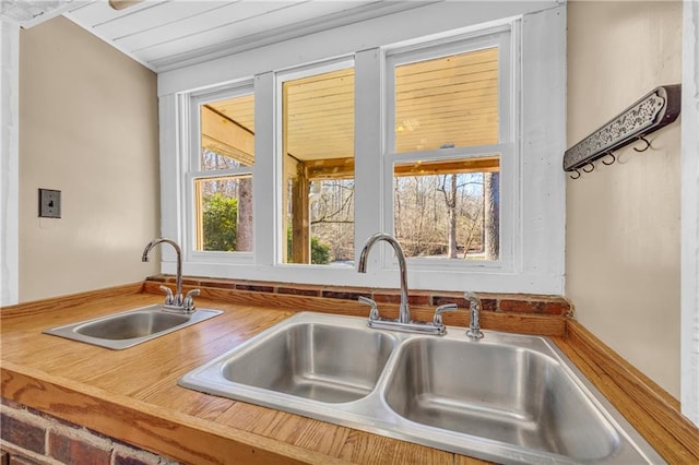 kitchen featuring wooden counters and sink