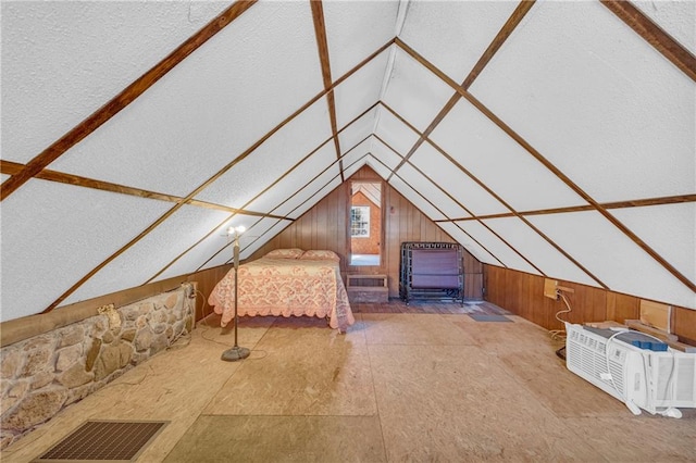 unfurnished bedroom featuring lofted ceiling