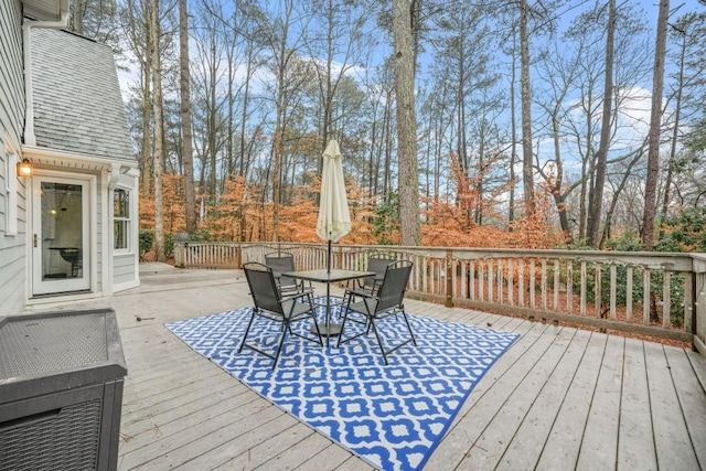 wooden deck featuring outdoor dining space