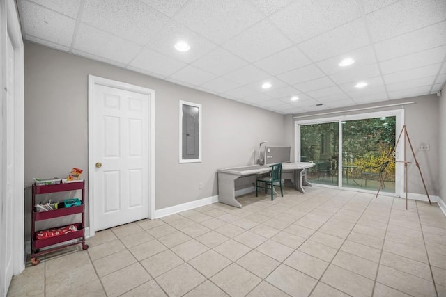 home office featuring light tile patterned flooring, recessed lighting, a paneled ceiling, and baseboards