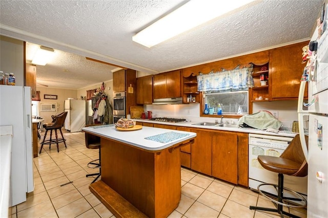 1278 Twin Pine Rd, Milledgeville, GA 31061 - kitchen featuring a textured ceiling, stainless steel appliances, under cabinet range hood, open shelves, and light tile patterned floors