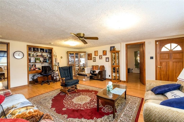 1278 Twin Pine Rd, Milledgeville, GA 31061 - living room featuring wood finished floors, a textured ceiling, and ceiling fan