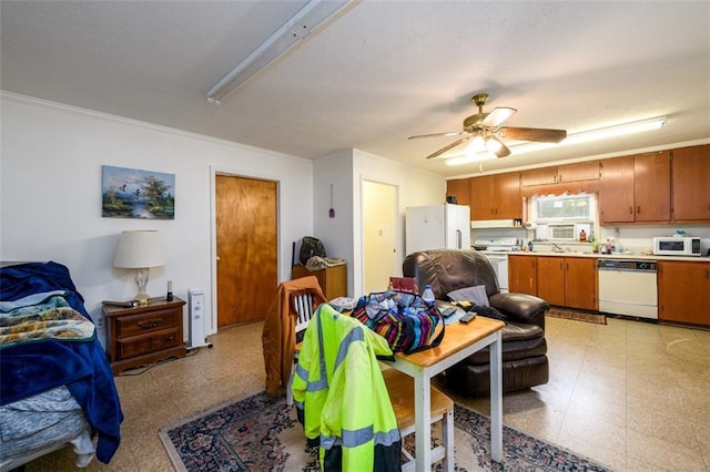 1278 Twin Pine Rd, Milledgeville, GA 31061 - kitchen featuring white appliances, open floor plan, ornamental molding, light countertops, and brown cabinetry