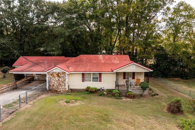 1278 Twin Pine Rd, Milledgeville, GA 31061 - view of front of home featuring covered porch, concrete driveway, an attached carport, a metal roof, and stone siding