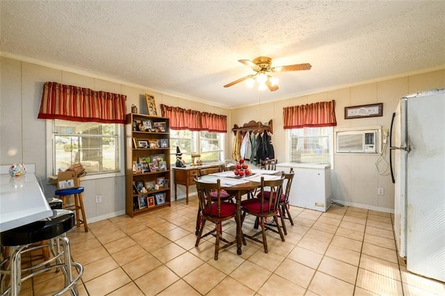 1278 Twin Pine Rd, Milledgeville, GA 31061 - dining area featuring ornamental molding, ceiling fan, a textured ceiling, light tile patterned floors, and a wall unit AC