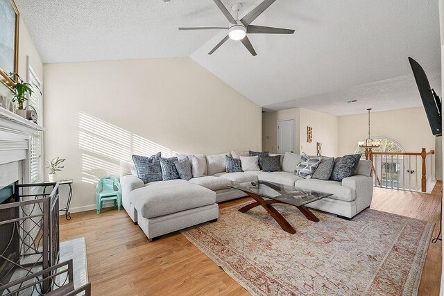 bedroom featuring ceiling fan, hardwood / wood-style floors, and a textured ceiling