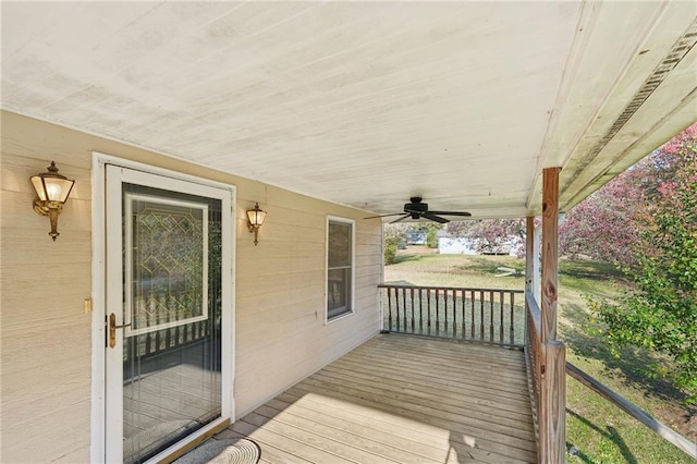 deck featuring ceiling fan and a porch